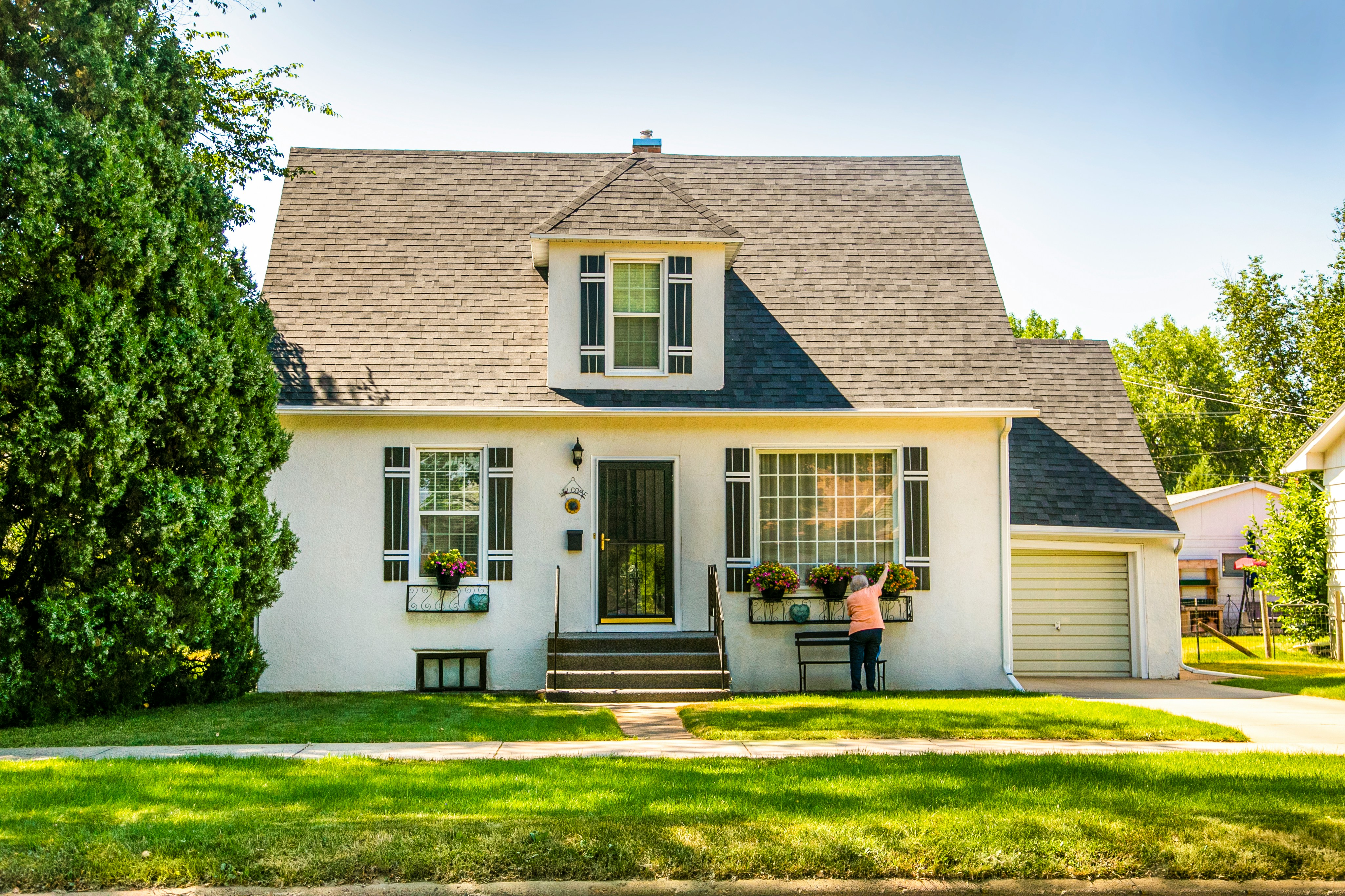 Charming craftsman home with a green front lawn