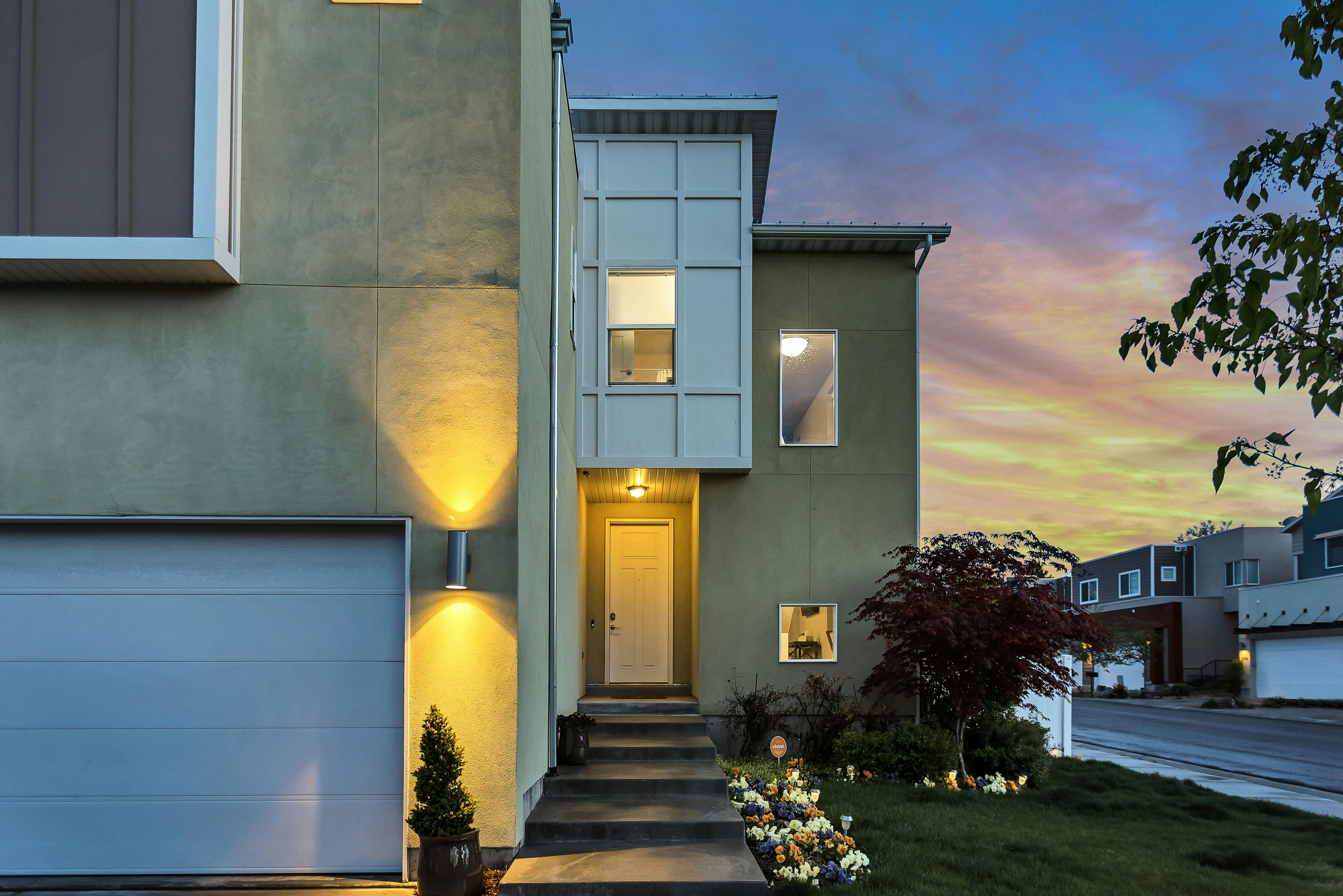 Contemporary home at twilight with warm lighting